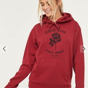 Red "think less, feel more" hoodie